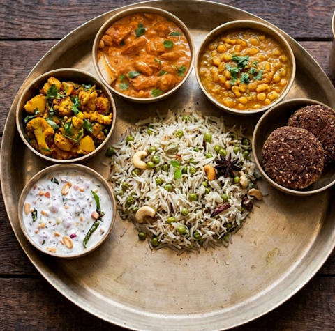 Chicken Tikka Masala Thali with Patiala Chana Daal, Gobi Adraki, Matar Pulao, Alsi Ki Pinni (Laddoo), Raita of the Day