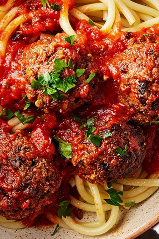 Vegan Meatballs in marinara side of pasta salad