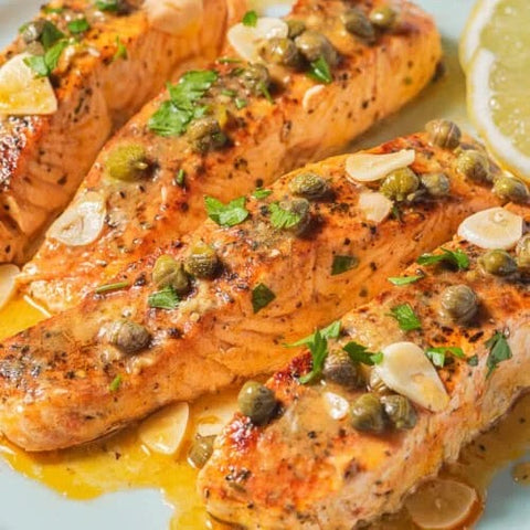 Grilled Salmon Picatta in creamy lemon caper sauce w/roasted veggies