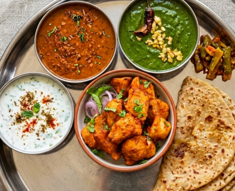 Amritsari Macchi, Daal Maharani, Lehsuni Saag & Trikona Paratha Bowl