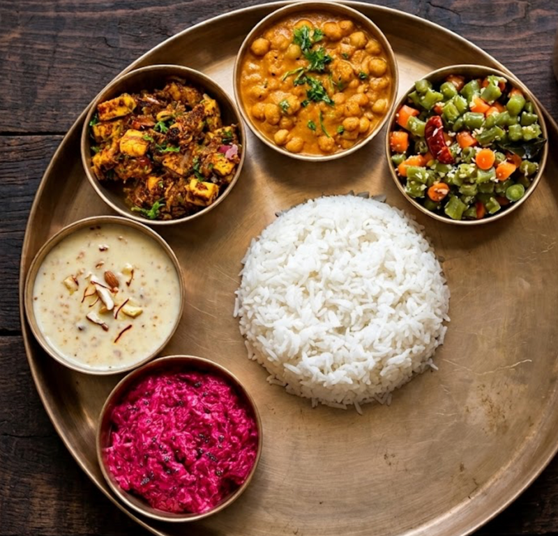 Paneer Sukha Thali with Chana Kurma, Green Beans Carrot Poriyal, Sona Masuri Rice, Jackfruit Mung Daal Payassam, Raita of the Day